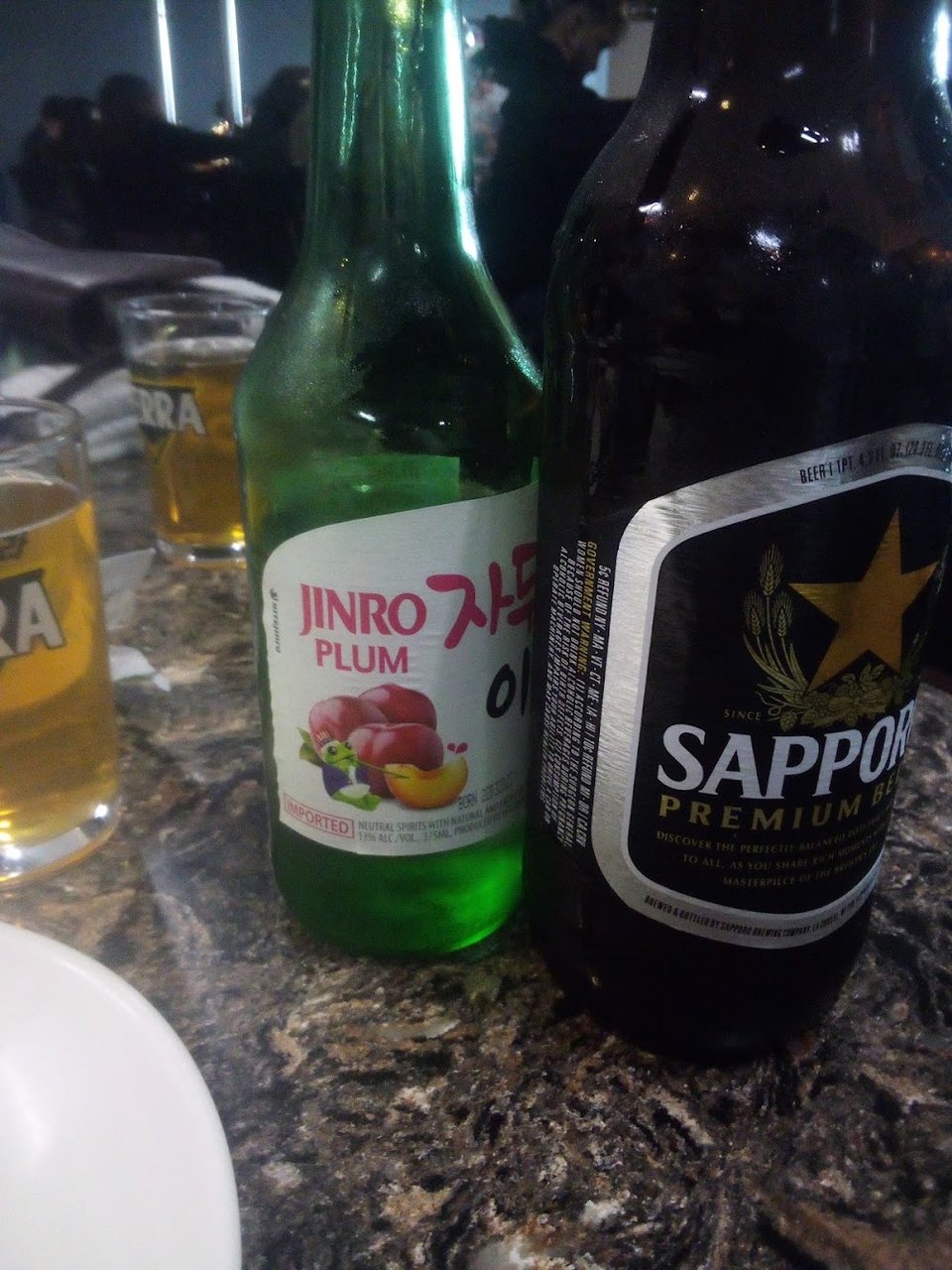 Printed menu showing hot tea and soju.